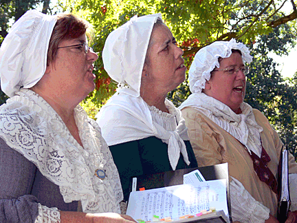 Three women of Colonial Revelers sing from their hearts.